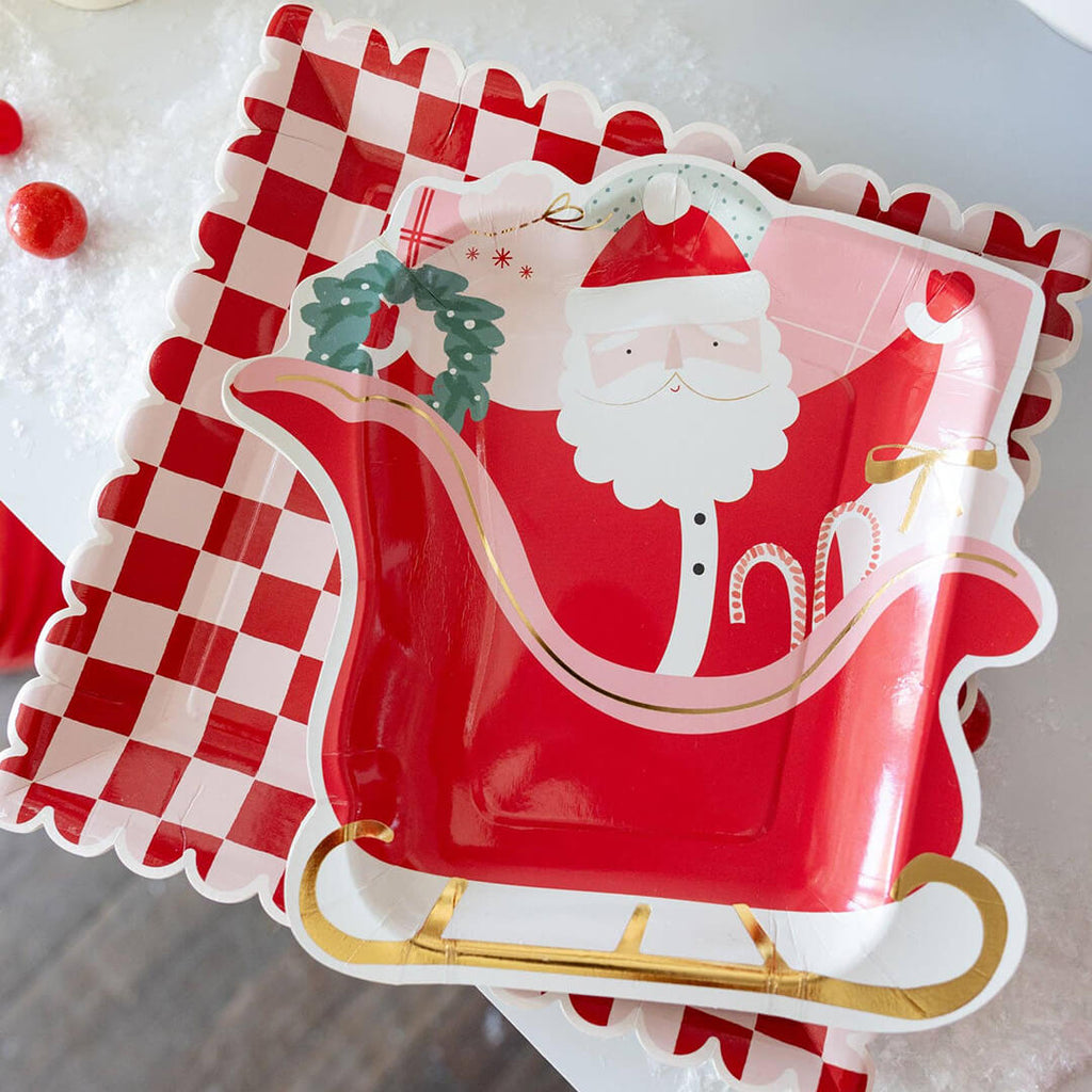 santas-sleigh-shaped-paper-plates-styled-pink-red-checker-christmas-table